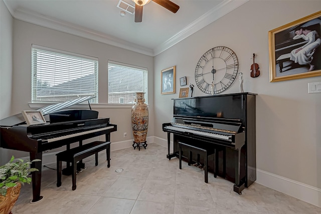 sitting room featuring crown molding, light tile patterned floors, visible vents, a ceiling fan, and baseboards