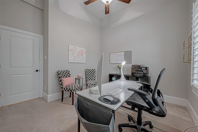 home office featuring high vaulted ceiling, light carpet, ceiling fan, and baseboards