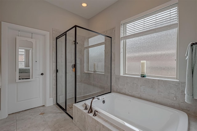 full bath featuring a stall shower, a bath, and tile patterned floors