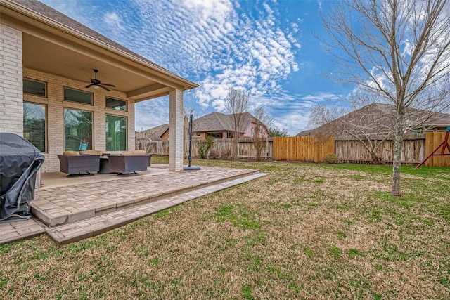 view of yard with a ceiling fan, a patio area, a fenced backyard, and an outdoor hangout area