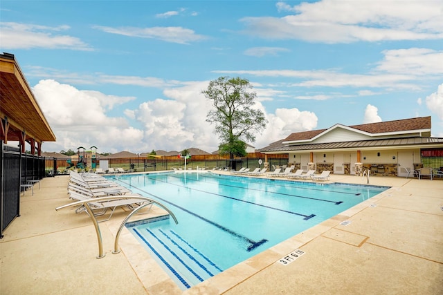 view of swimming pool featuring a patio