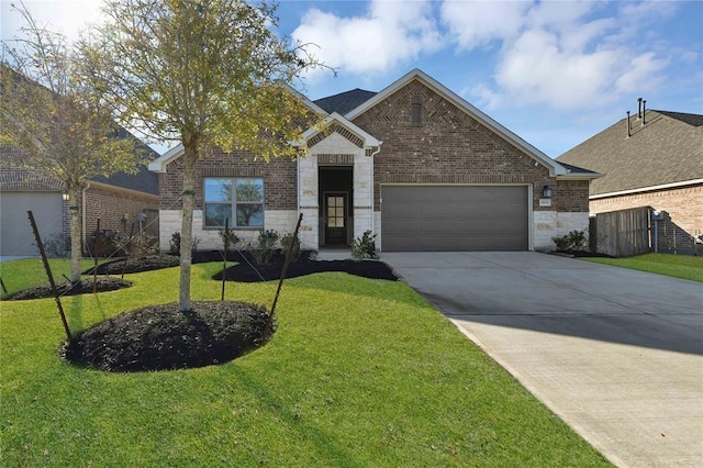 view of front of property featuring a garage and a front lawn