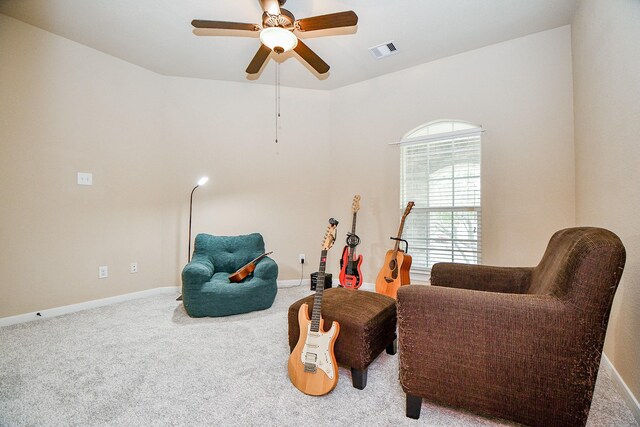 sitting room with ceiling fan and carpet floors