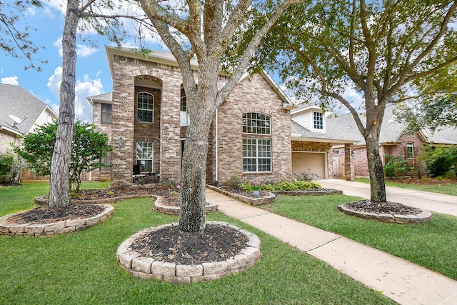 view of front of home with a garage and a front yard