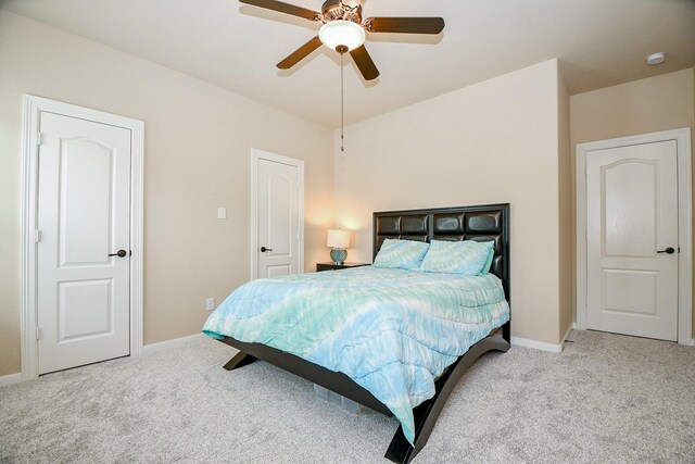 carpeted bedroom featuring ceiling fan