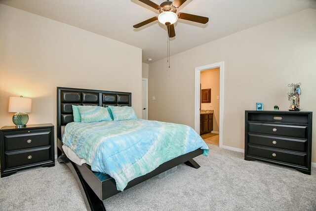 carpeted bedroom featuring ceiling fan and connected bathroom