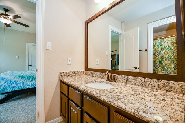 bathroom featuring ceiling fan and vanity