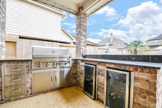 view of patio / terrace with a grill, area for grilling, and wine cooler