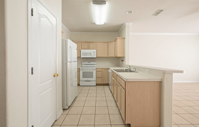 kitchen featuring light brown cabinetry, a kitchen breakfast bar, ornamental molding, light tile patterned floors, and white appliances