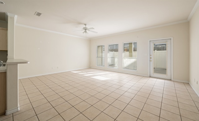 spare room featuring ornamental molding and ceiling fan