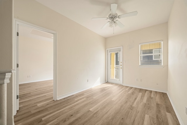 spare room featuring ceiling fan and light hardwood / wood-style flooring