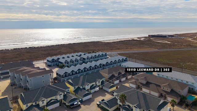 aerial view featuring a view of the beach and a water view