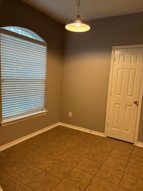 spare room with tile patterned floors