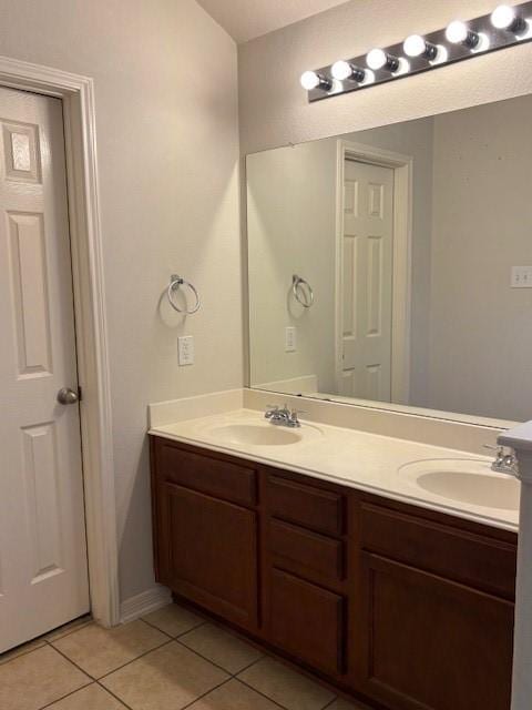 bathroom with vanity and tile patterned floors