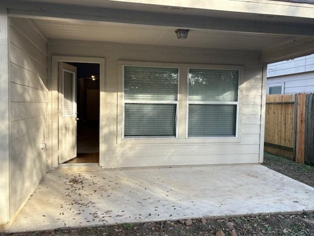 doorway to property with a patio area