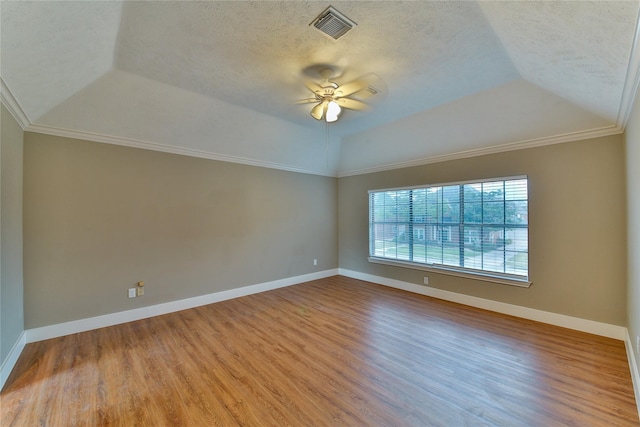 interior space featuring hardwood / wood-style floors, vaulted ceiling, a textured ceiling, and ceiling fan