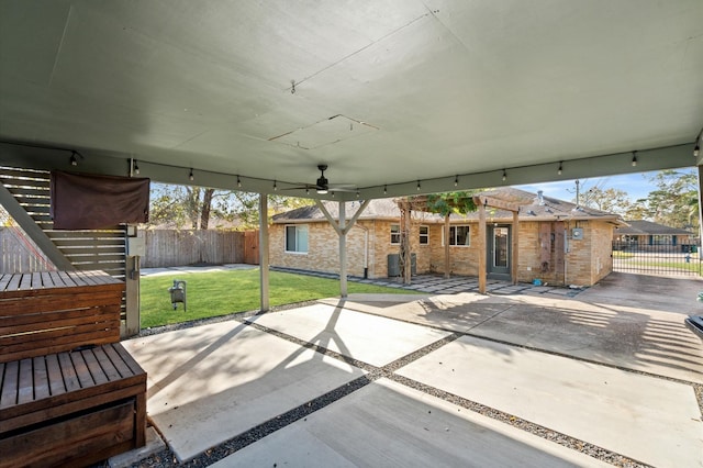 view of patio / terrace featuring fence