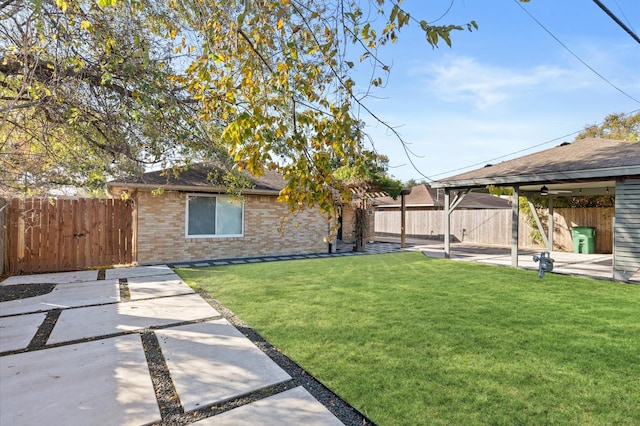 view of yard featuring a patio and a fenced backyard