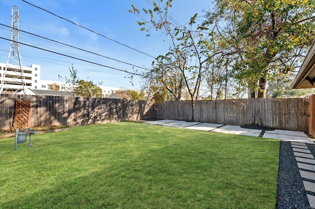 view of yard featuring a fenced backyard