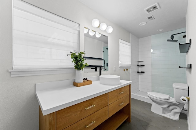 full bath featuring visible vents, a walk in shower, toilet, and vanity