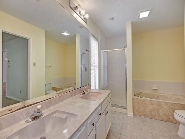 full bath featuring tile patterned flooring, a sink, toilet, and a bath