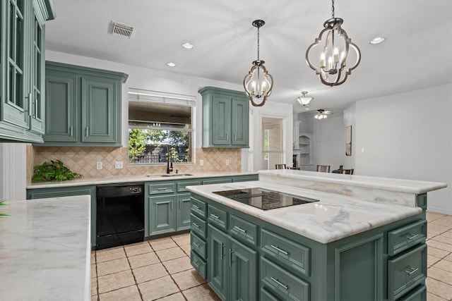 kitchen with sink, green cabinetry, decorative light fixtures, a kitchen island, and black appliances