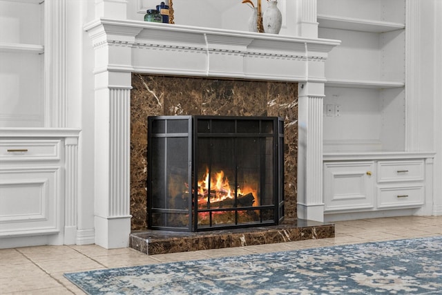 interior details with a premium fireplace and built in features