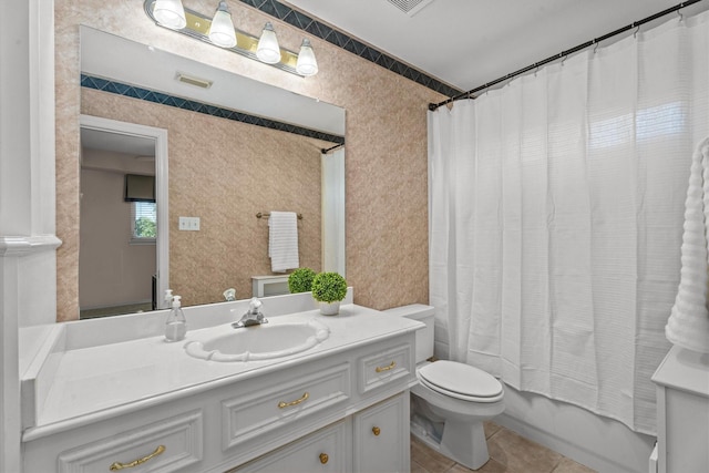 full bathroom featuring vanity, tile patterned floors, toilet, and shower / bathtub combination with curtain