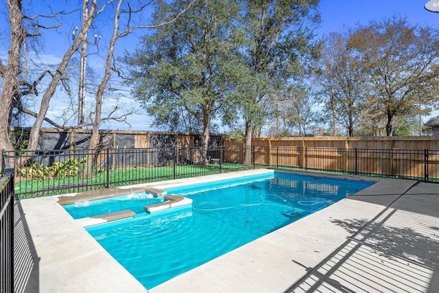 view of swimming pool featuring an in ground hot tub and a patio