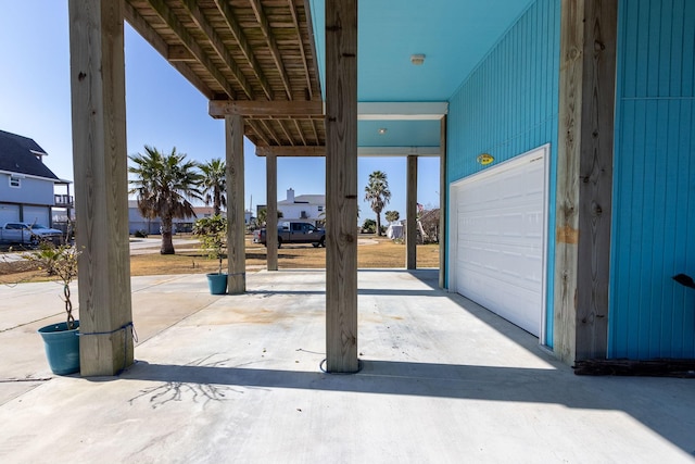 view of patio featuring a garage