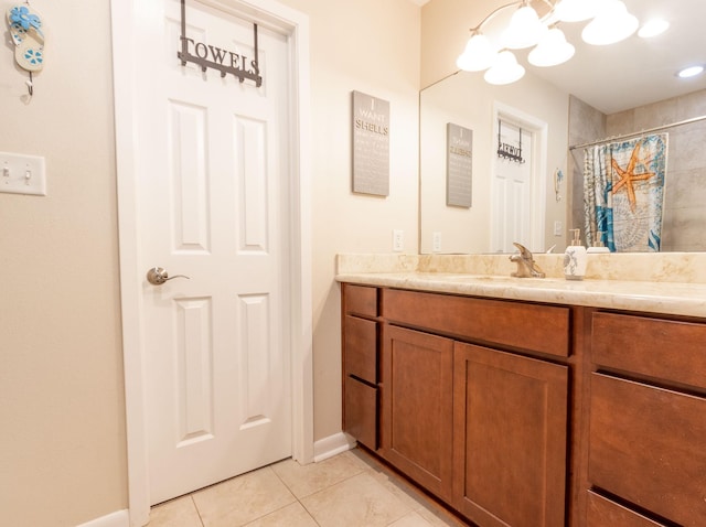 bathroom with walk in shower, tile patterned floors, and vanity