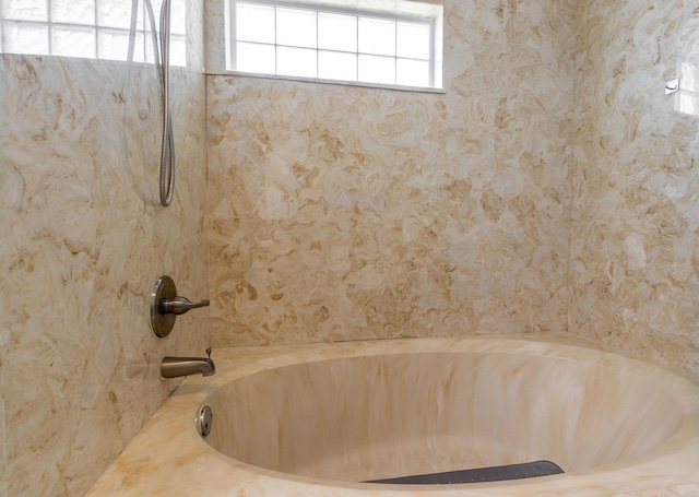 bathroom with a bathing tub