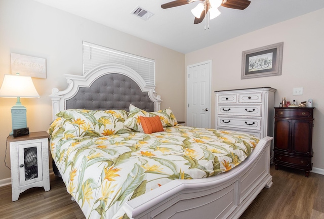 bedroom featuring dark hardwood / wood-style flooring and ceiling fan