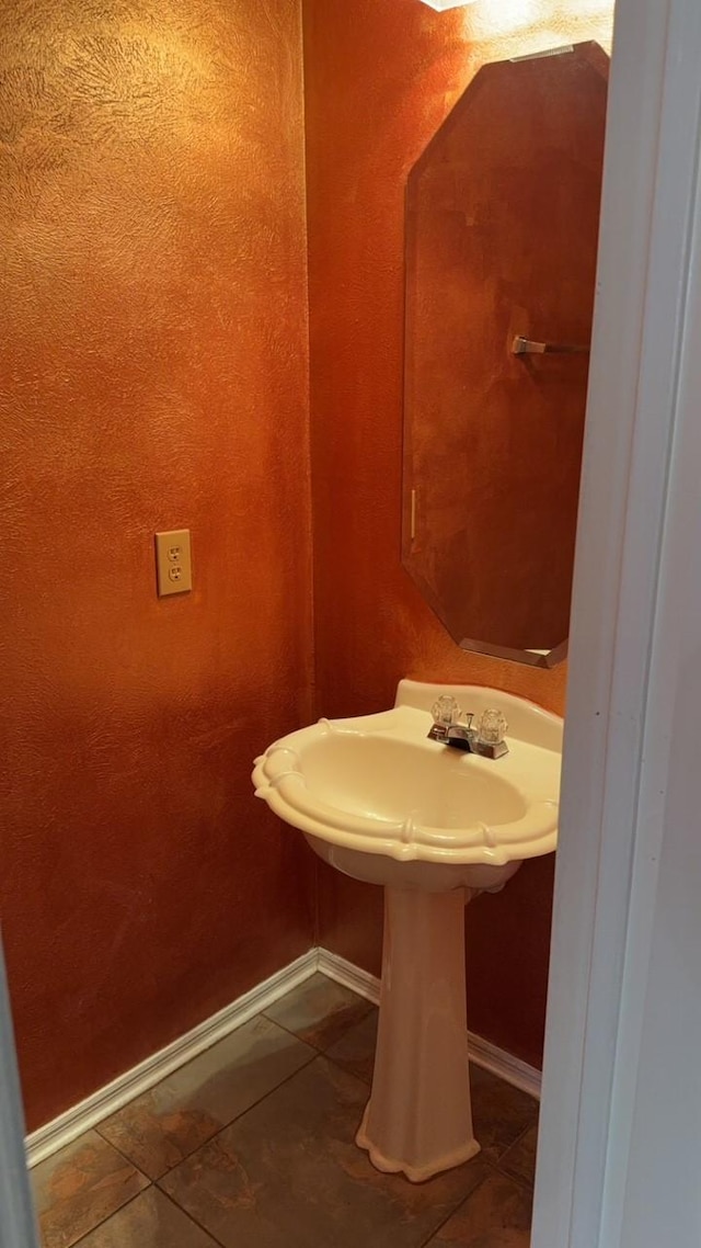 bathroom with tile patterned floors