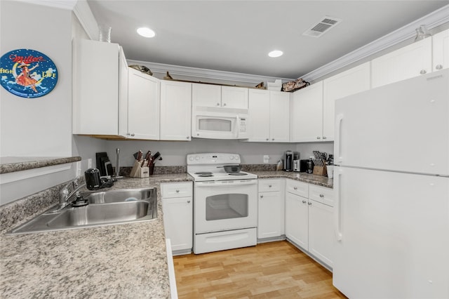 kitchen with white cabinetry, ornamental molding, sink, and white appliances