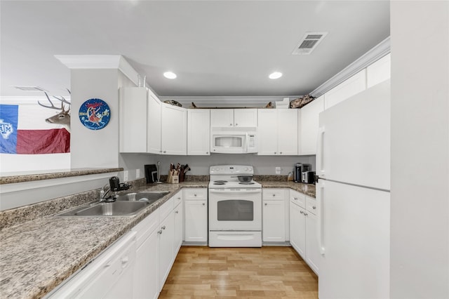 kitchen with white cabinetry, white appliances, light hardwood / wood-style floors, and sink