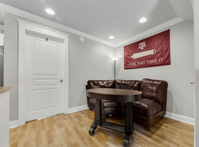 sitting room featuring crown molding and wood-type flooring