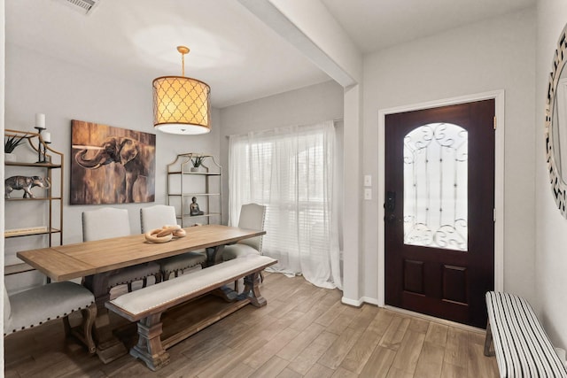 entryway with hardwood / wood-style flooring