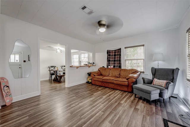 living room featuring hardwood / wood-style flooring and ceiling fan