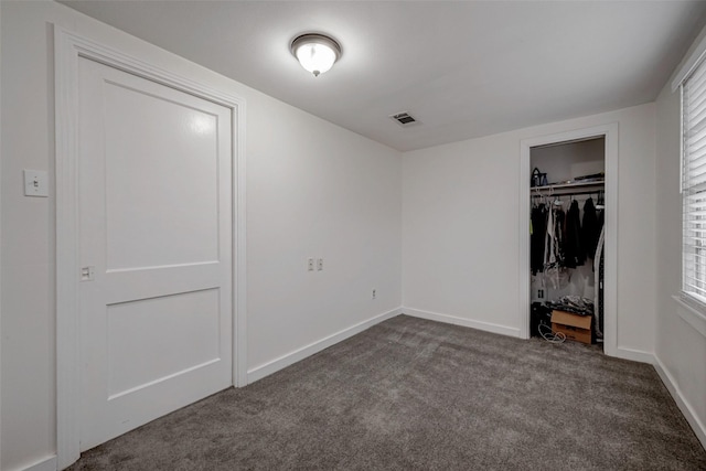 unfurnished bedroom featuring a closet and carpet