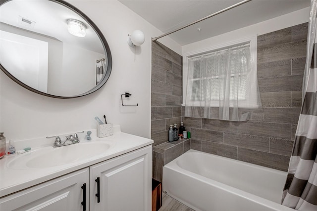 bathroom featuring shower / tub combo with curtain and vanity