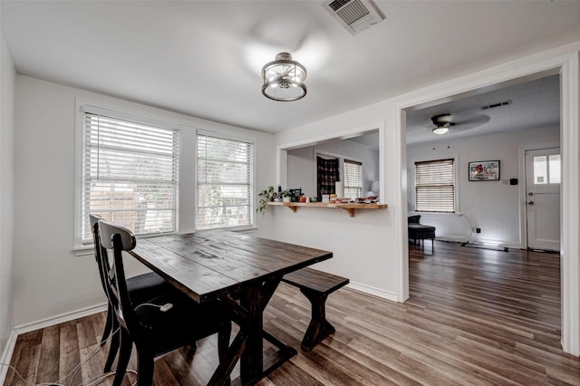 dining room with hardwood / wood-style floors