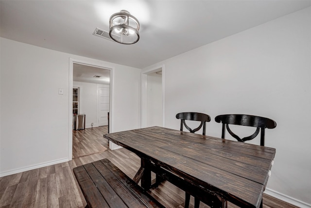 dining area featuring light wood-type flooring