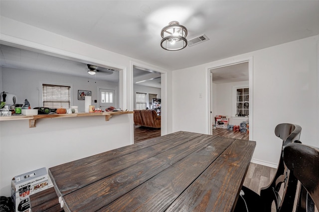 dining area featuring hardwood / wood-style floors and ceiling fan