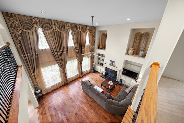 living room featuring hardwood / wood-style floors and built in features