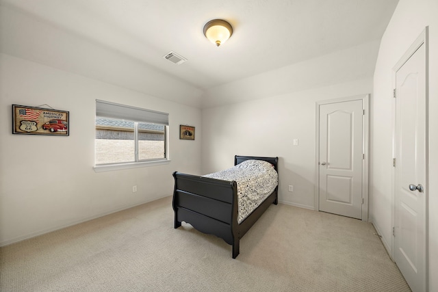 bedroom featuring light colored carpet