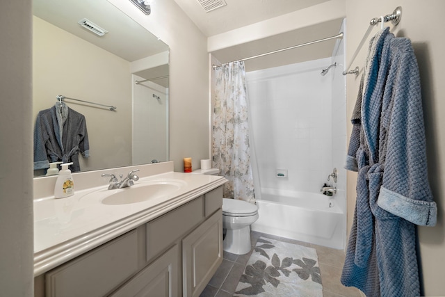 full bathroom featuring tile patterned flooring, vanity, toilet, and shower / bath combo with shower curtain