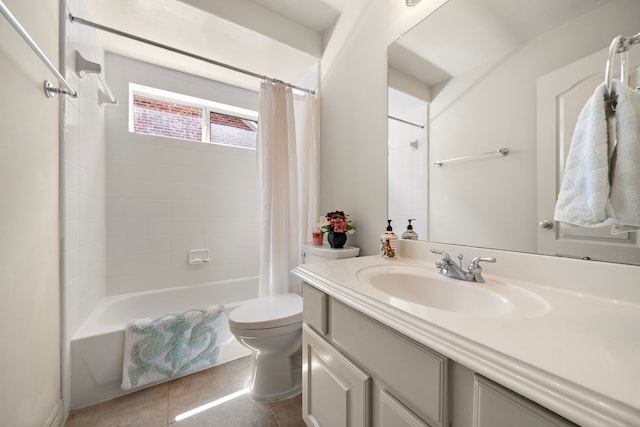 full bathroom featuring tile patterned flooring, vanity, toilet, and shower / bath combo with shower curtain