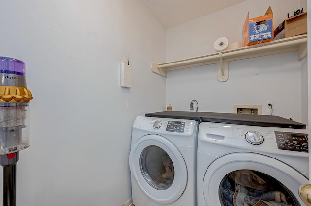 laundry room featuring washing machine and clothes dryer