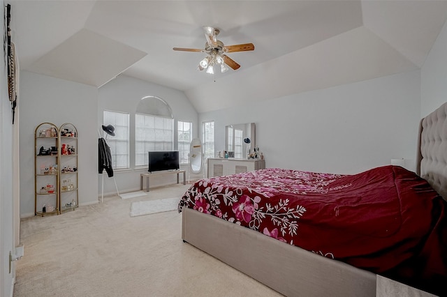 bedroom featuring ceiling fan, light colored carpet, and lofted ceiling